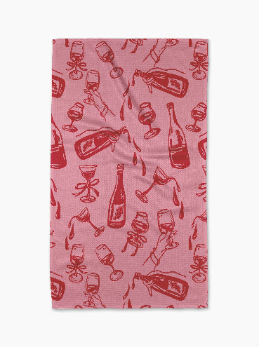 Pink fabric with red wine bottle and glass pattern on a white background