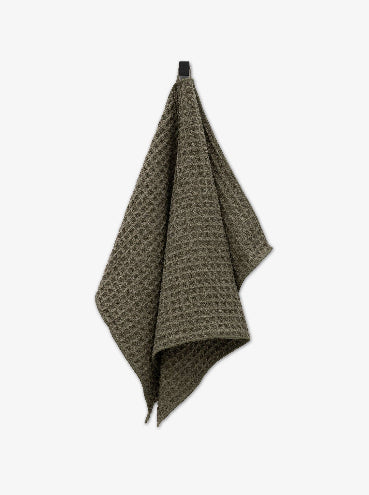 Waffle-textured towel on a white background