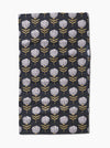 Floral patterned towel with white flowers on a dark background