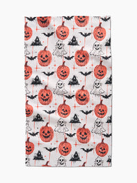 Halloween-themed fabric with pumpkins, ghosts, and bats on a white background