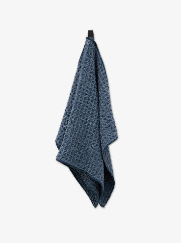 Blue textured towel on a white background