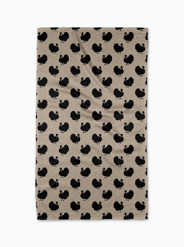 Beige towel with black turkey pattern on a white background