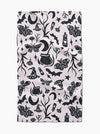 Patterned fabric with black Halloween-themed designs on a white background